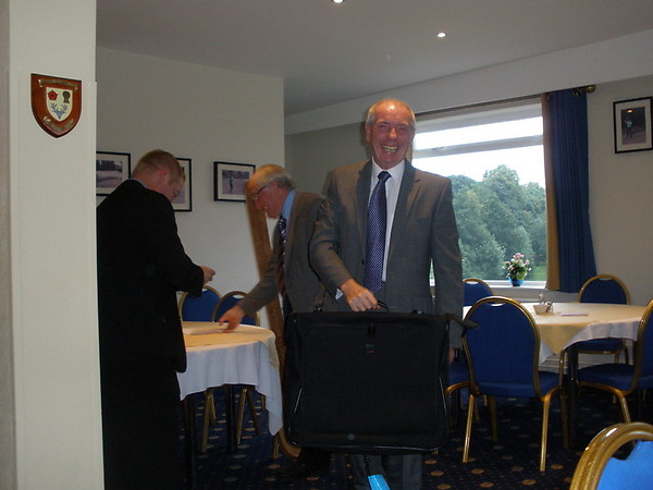 Les adds to his collection of suit bags